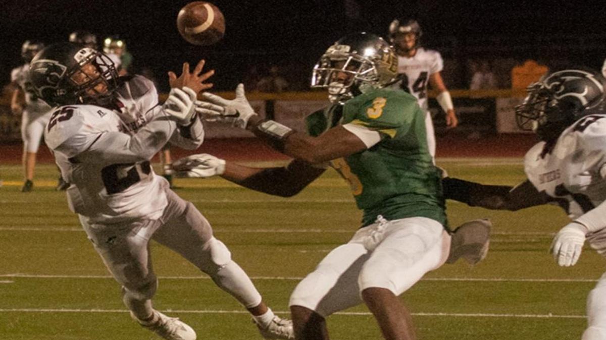 Carolina Forest’s Richmond Collier (25) battles Myrtle Beach’s Will Vereen (3) during Friday’s game.