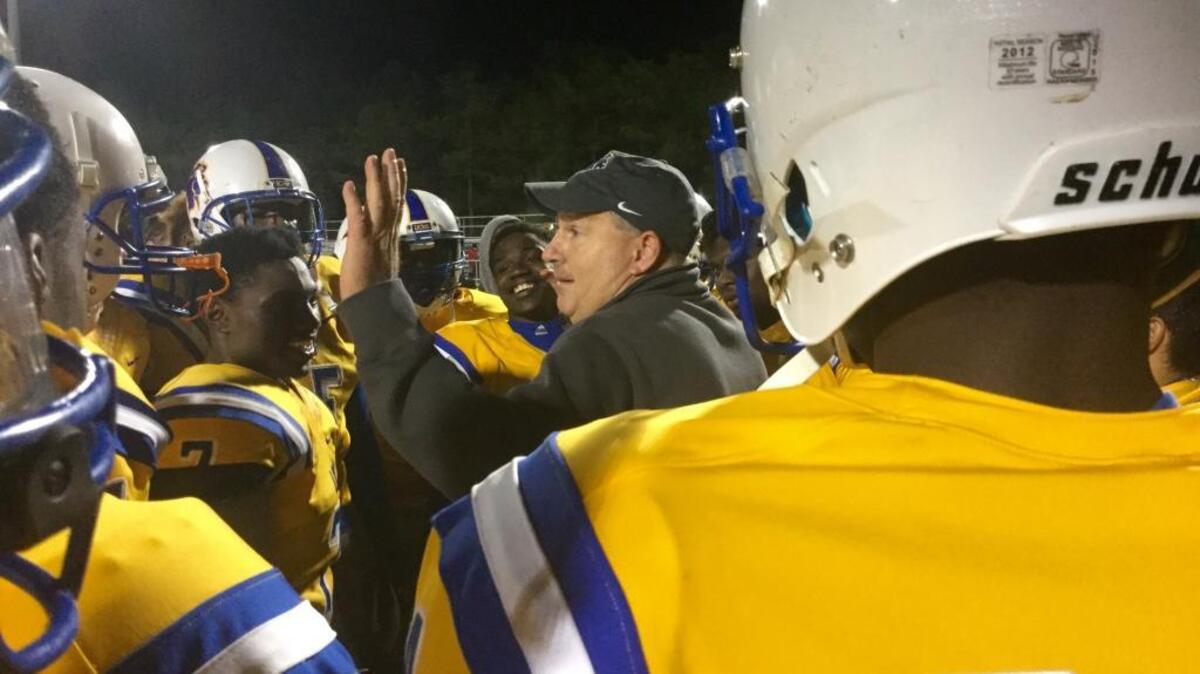 Loris head coach Jamie Snider gives his team marching orders during Friday’s game against Wade Hampton.