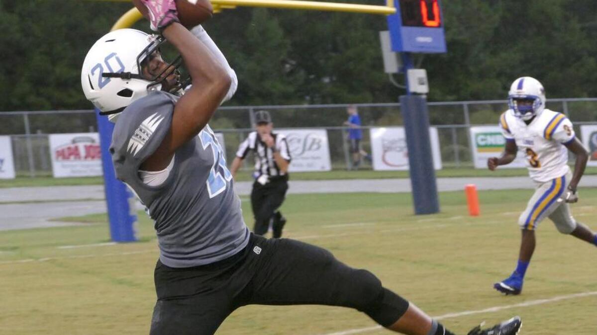 
St. James’ Jay-Mion Pressley catches this pass for a touchdown during Friday’s win over Loris.
