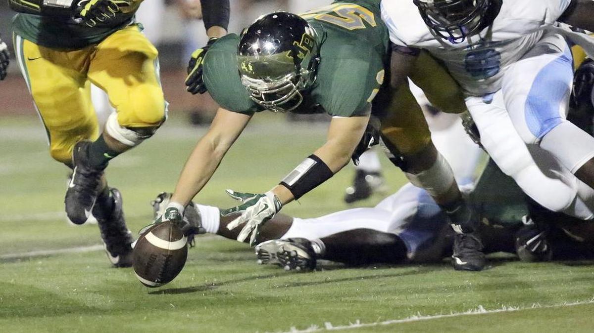 
Myrtle Beach’s Noah Thomas recovers a fumble against St. James on Friday.
