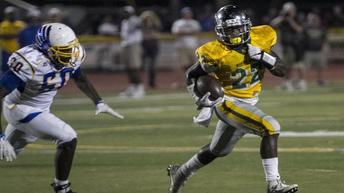 Myrtle Beach running back Jermani Green rounds the corner during a run against North Myrtle Beach a few weeks ago.