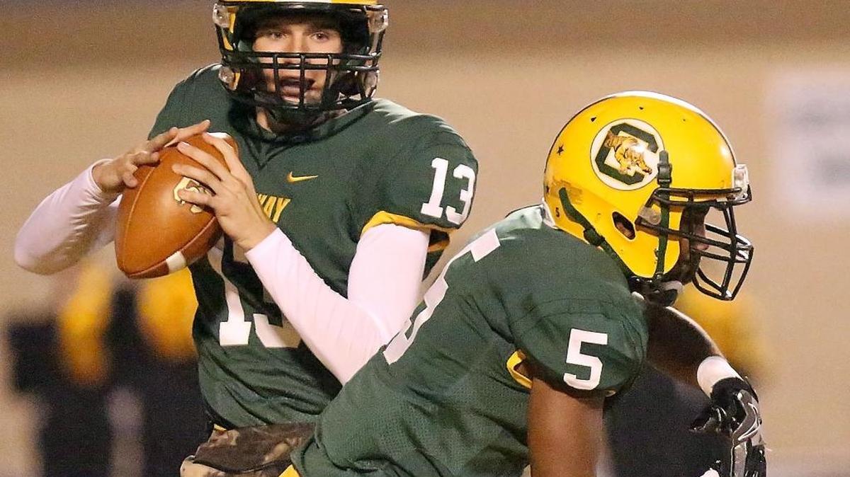 Conway quarterback Peyton Derrick (13) watches a play unfold last football season.