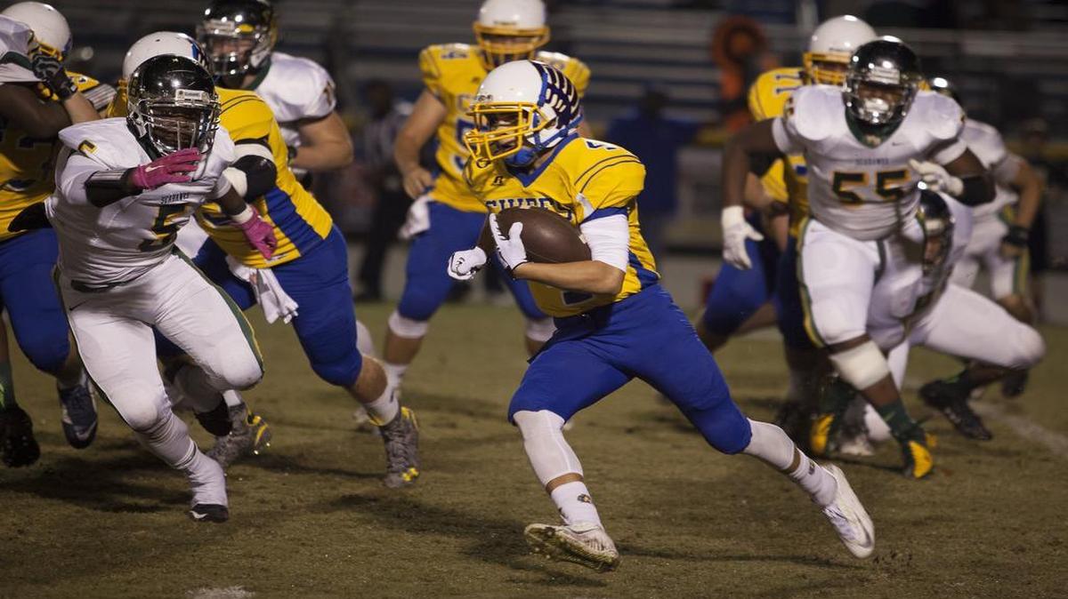 North Myrtle Beach running back Kered Class (4) looks for an opening against Myrtle Beach on Friday.