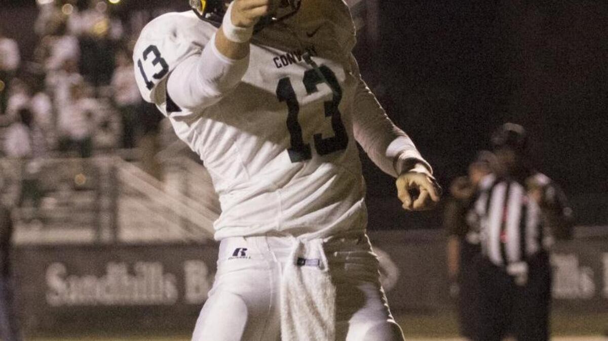 Conway quarterback Peyton Derrick celebrates one of his five rushing touchdowns during the Tigers’ 51-48 triple overtime win over Carolina Forest last week.