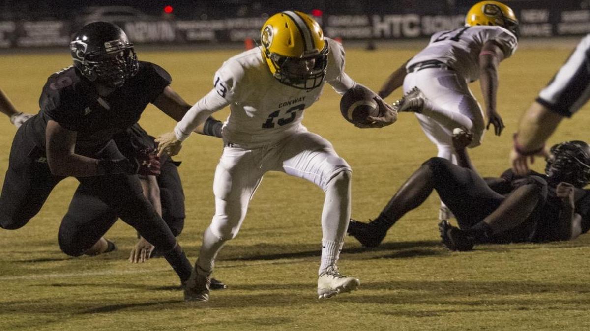 Conway quarterback Peyton Derrick scrambles into the end zone for one of his five touchdowns Friday night in a 51-48 triple overtime win over Carolina Forest.