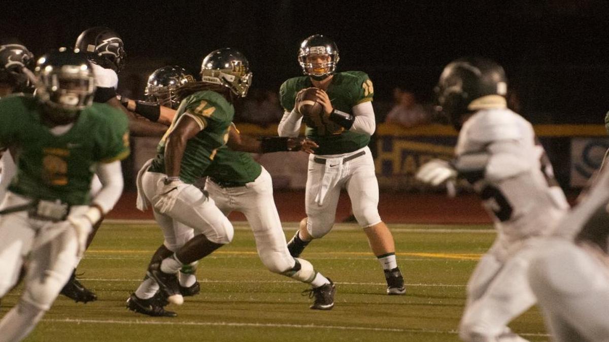 Myrtle Beach quarterback Lawson Cribb looks for a receiver last Friday night during the Seahawks’ game with Carolina Forest.