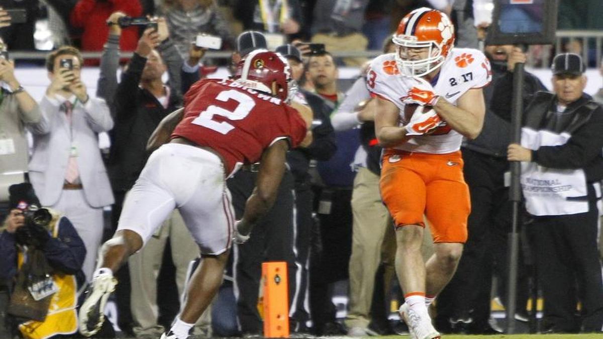 Clemson Tigers wide receiver Hunter Renfrow (13) scores the winning touchdown in Monday’s national title game against Alabama.