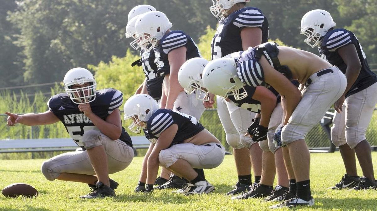 Members of the Aynor offensive line prepare for the next play during a morning practice last summer. A new rule established Wednesday by the S.C. High School League Executive Committee restricts full contact at football practices to 90 minutes beginning this season.