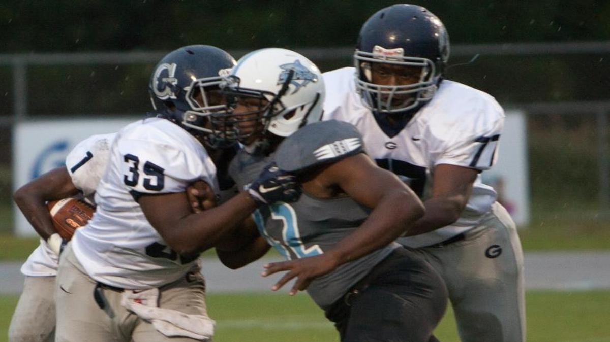 
Georgetown's Ahmad Swinton (35) blocks for Christian Johnson (1) as the Sharks host the Bulldogs Thursday.
