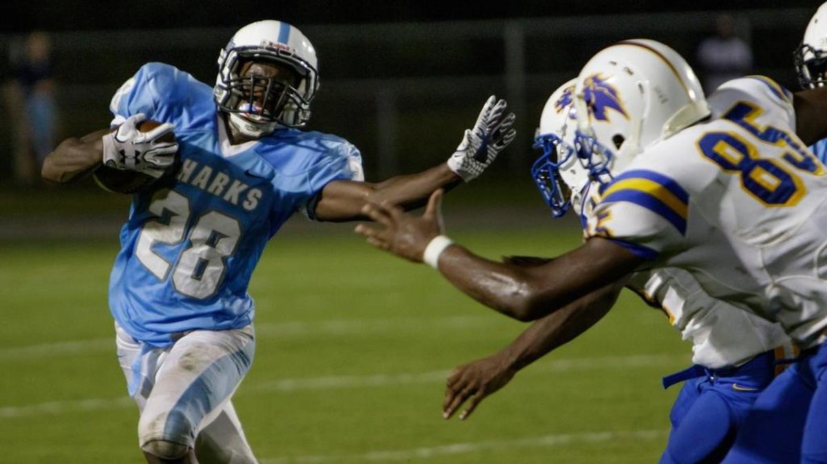 St. James running back Chris Anderson tries to create some separation from Loris tacklers during last Friday’s game.