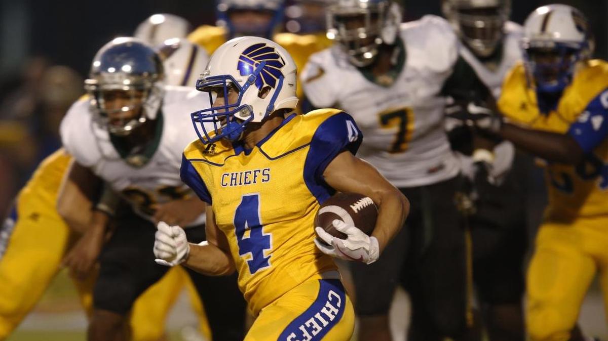 North Myrtle Beach running back Kered Class runs by Myrtle Beach defenders during the game between rivals this past season.