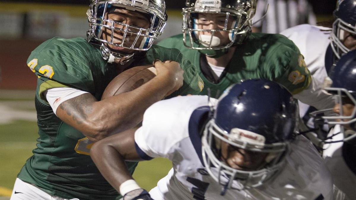 Myrtle Beach running back Brandon Sinclair (22) tries to break through Georgetown's defenders during 2nd quarter action as the Seahawks hosted Georgetown Friday night at Doug Shaw Stadium.
