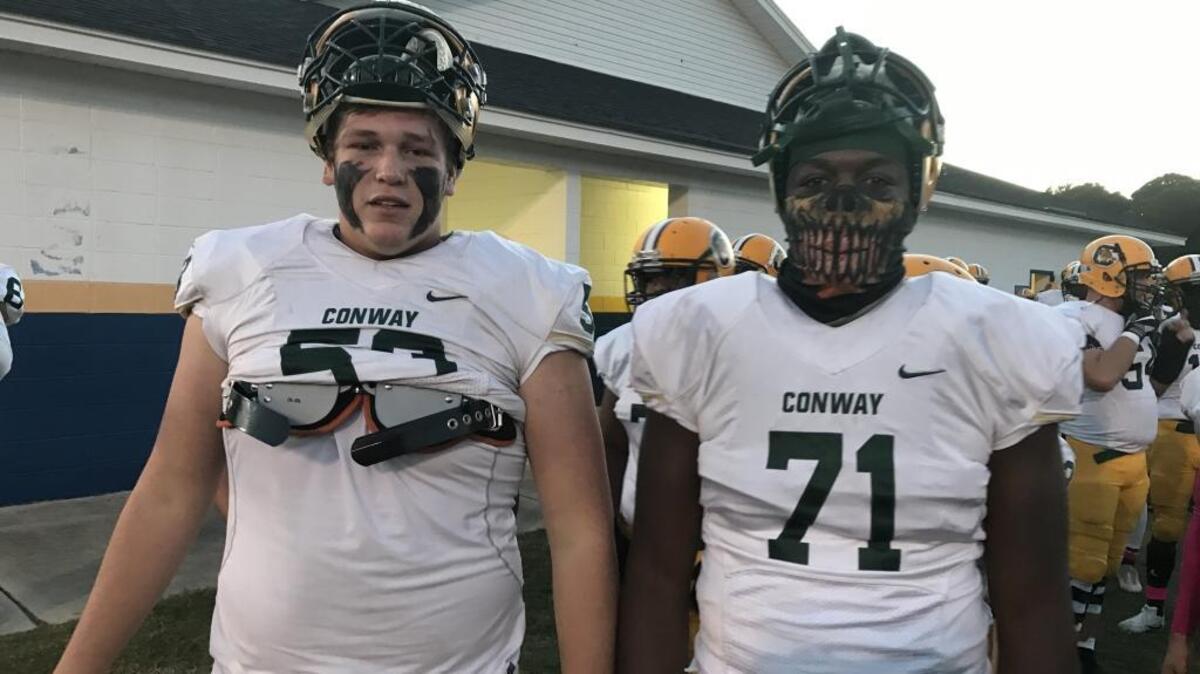 Both members of the Conway offensive line duo of Gunner Britton (left) and Raiqwon O’Neal were named to the USA Today all-state football team.