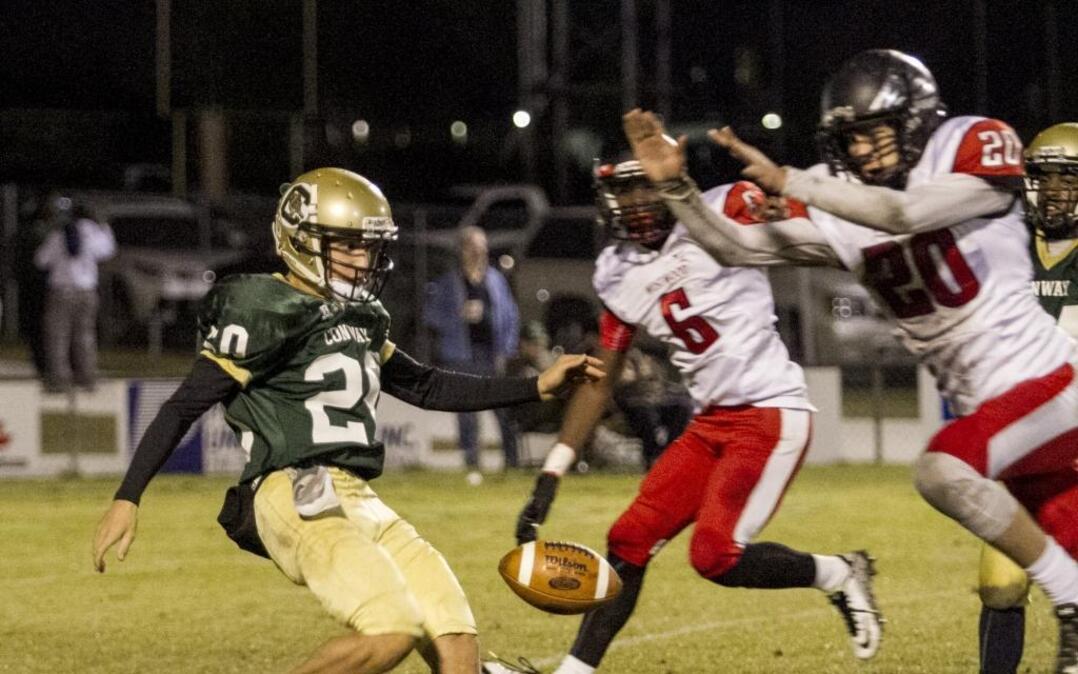 A punt off the foot of Conway’s Brady Fulmer is blocked by Shane Harkness of Westwood. The play would be a turning point in the game, as the Redhawks ran away with a 34-13 victory to eliminate the Tigers from the Class AAAA, Division II playoffs.