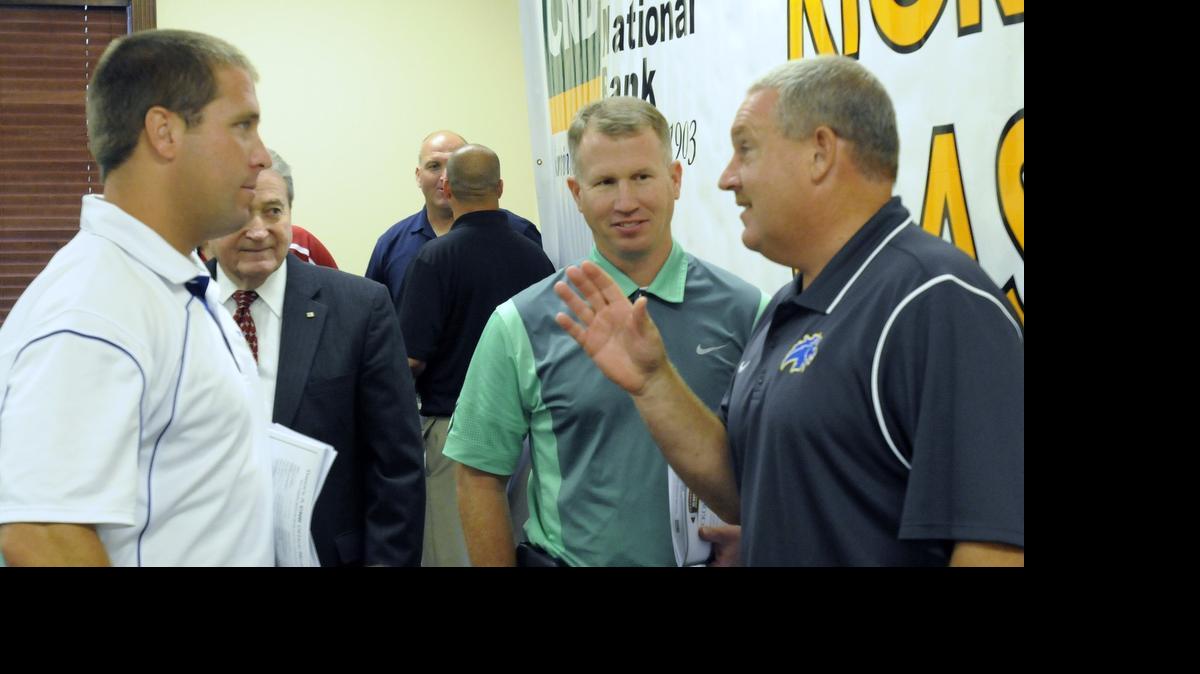 
North Myrtle Beach Chief coach Blair Hardin (left) talks with Loris coach Jamie Snider (right) and Myrtle Beach coach Mickey Wilson (center) during last year’s Conway National Bank Kickoff Classic press luncheon.
