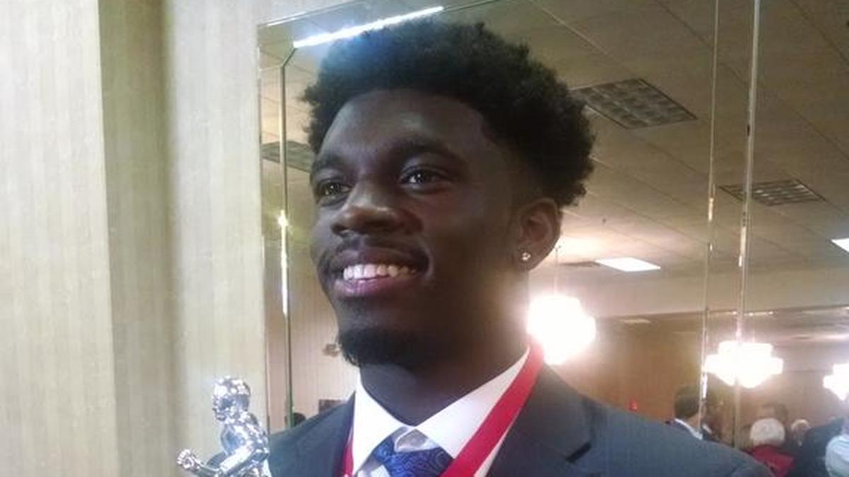 Spartanburg running back Tavien Feaster, a Clemson commit, proudly holds the S.C. Mr. Football award, given to the state’s finest player on the gridiron.