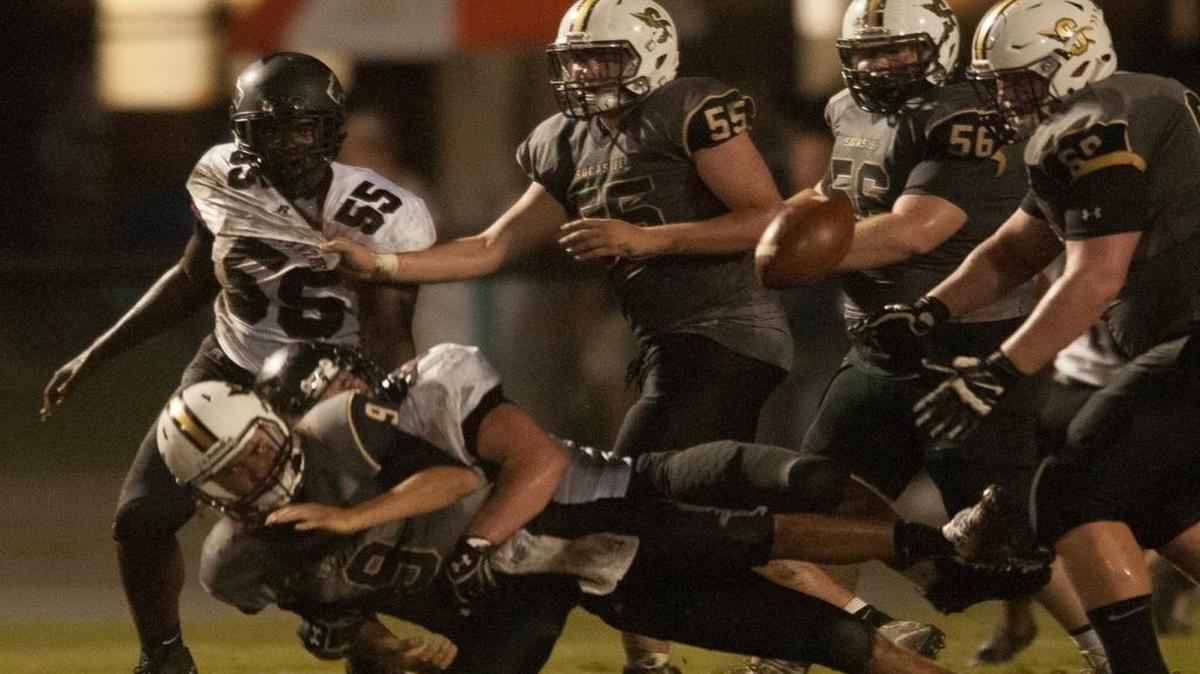 The ball pops loose as Socastee’s Hunter Illing goes down against Carolina Forest.