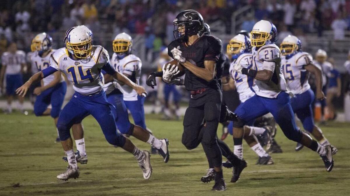 
Carolina Forest’s Damon McDowell (6) looks for a way around the North Myrtle Beach defense Friday.
