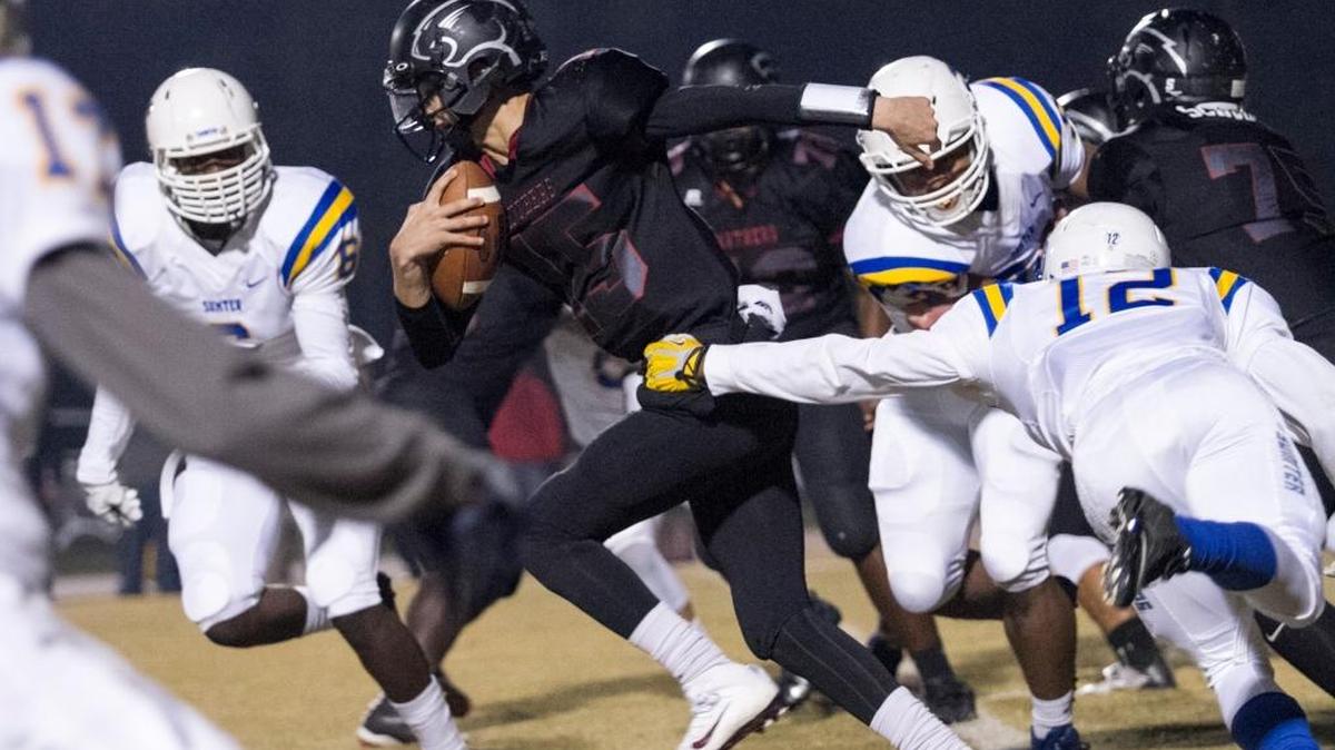 Surrounded by Sumter defenders, Carolina Forest’s Matt Beale looks for running room Friday night.