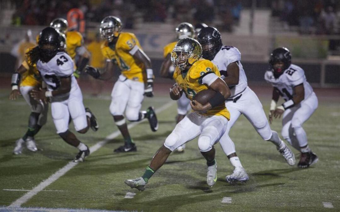 
Myrtle Beach’s Brandon Sinclair (22) looks for yardage against Carolina Forest on Friday.
