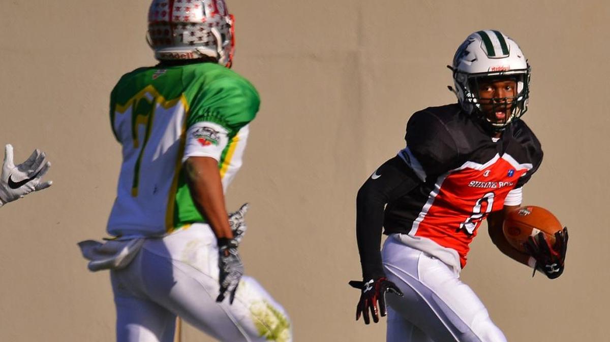 Football action between North and South Carolina in the 81st annual Shrine Bowl of the Carolinas, held at Gibbs Stadium at Wofford College in Spartanburg, Saturday, December 16, 2017. South Carolina WR Bryce Thompson (2) of Dutch Fork HS, runs the ball into the endzone for a touchdown against North Carolina in the first half. [TIM KIMZEY/Spartanburg Herald-Journal]