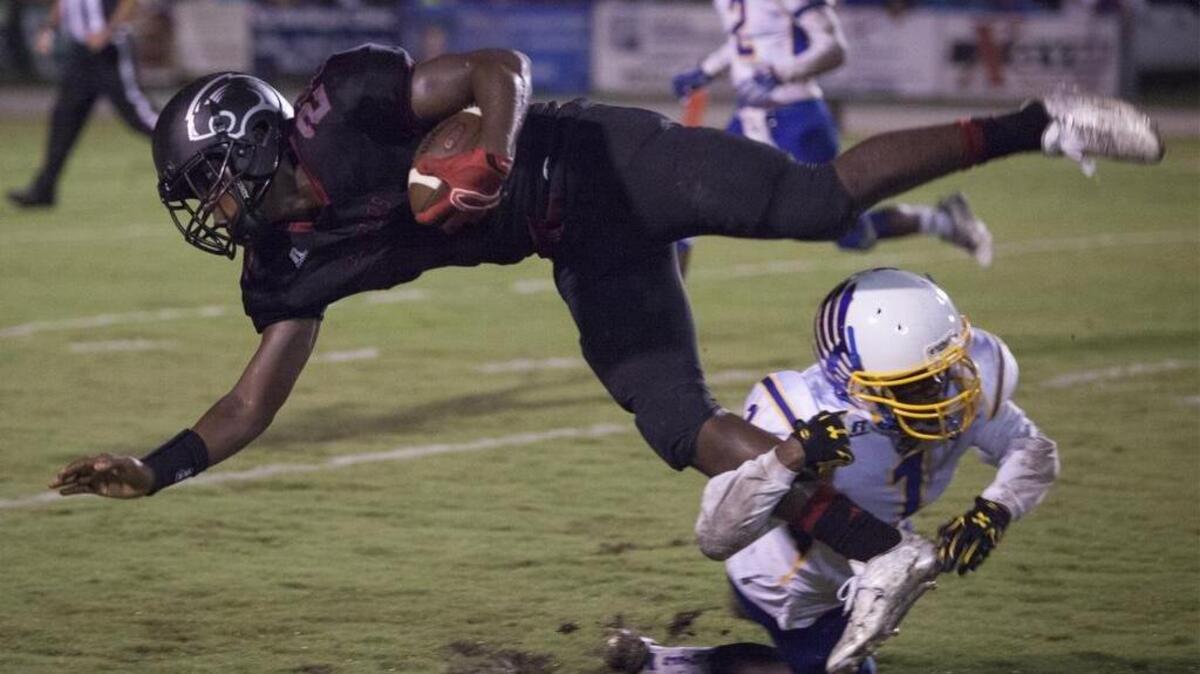 
Carolina Forest wide receiver Xavier Lynch, 24, tries to get some extra yardage during 2nd quarter action as the Panthers hosted North Myrtle Beach Friday night at Carolina Forest High School.
