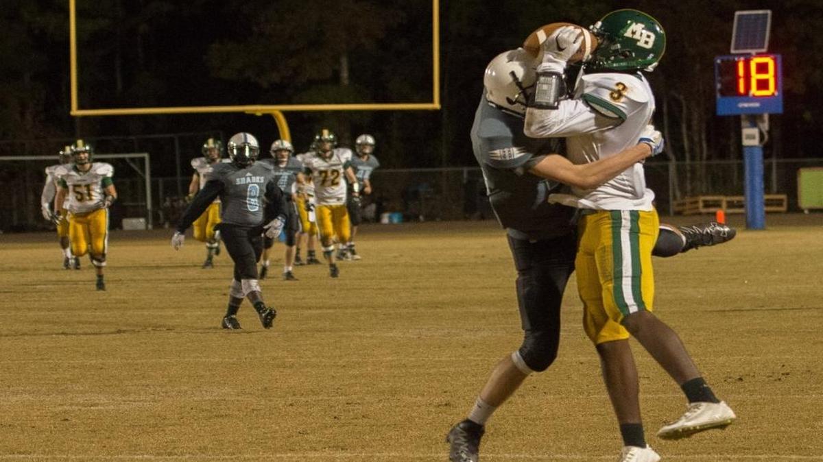 Myrtle Beach’s Will Vereen (right) brings down a catch over a St. James defender Friday night.
