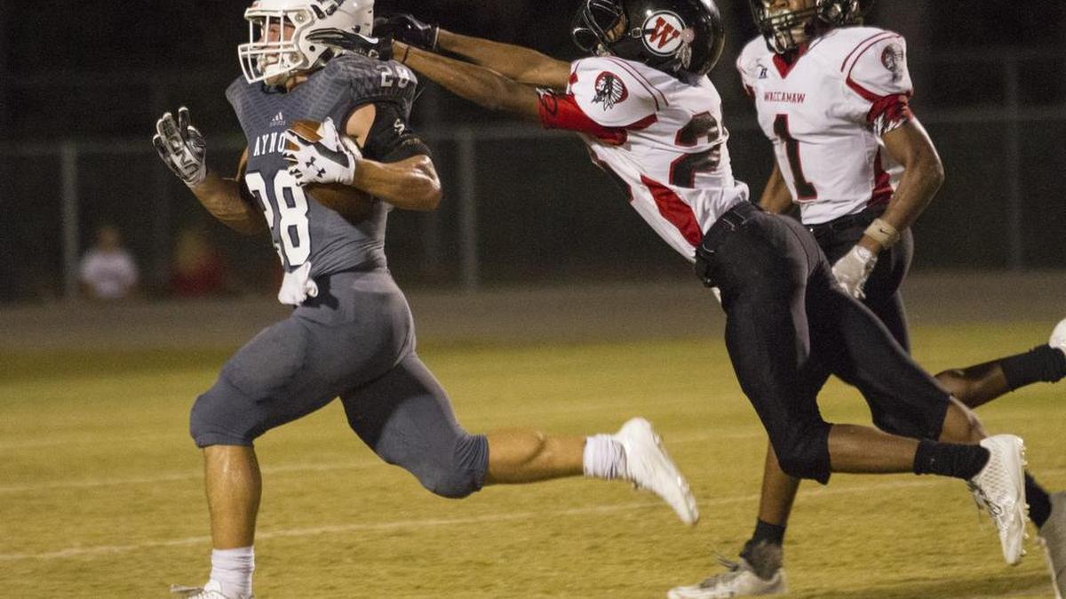 Aynor's Noah Seaver drives leaves Waccamaw tacklers behind during a big run in the first half. The Aynor Bluejackets hosted the Waccamaw Warriors in an offensive show down on Friday night. Oct. 6, 2017. The Blue Jackets won 57-33.