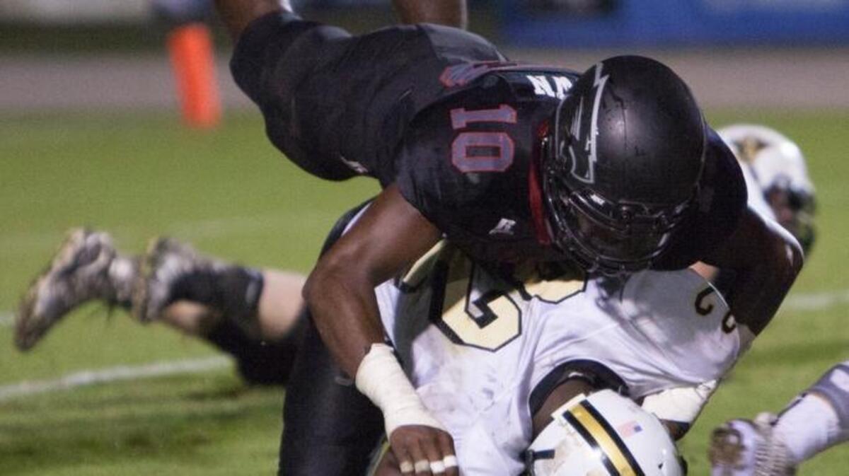 
Carolina Forest’s Jeff Mario Brown takes down Socastee running back Malachi McClendon during Friday’s game.
