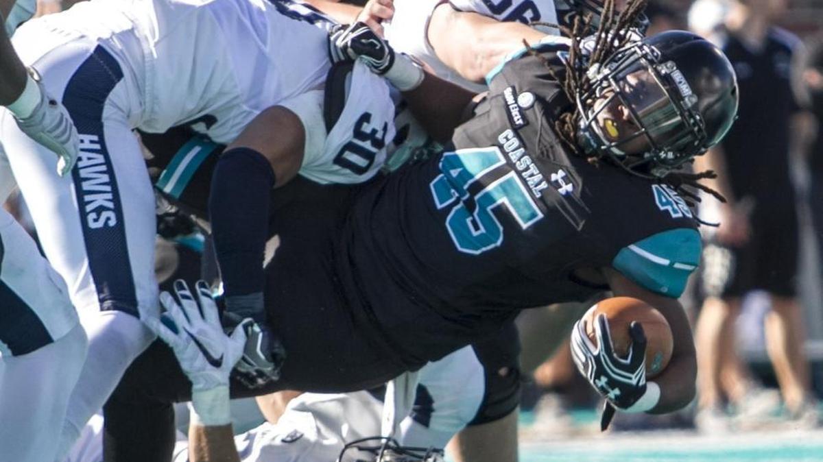Jah-Maine Martin dives for extra yards during a 2016 game with Coastal Carolina. The former Conway standout announced Thursday he will enroll at North Carolina A&T.
