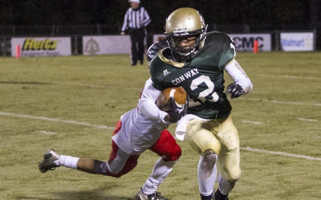 Conway’s Darren Stanley (2) breaks a tackle to run for a touchdown against Westwood on Friday.