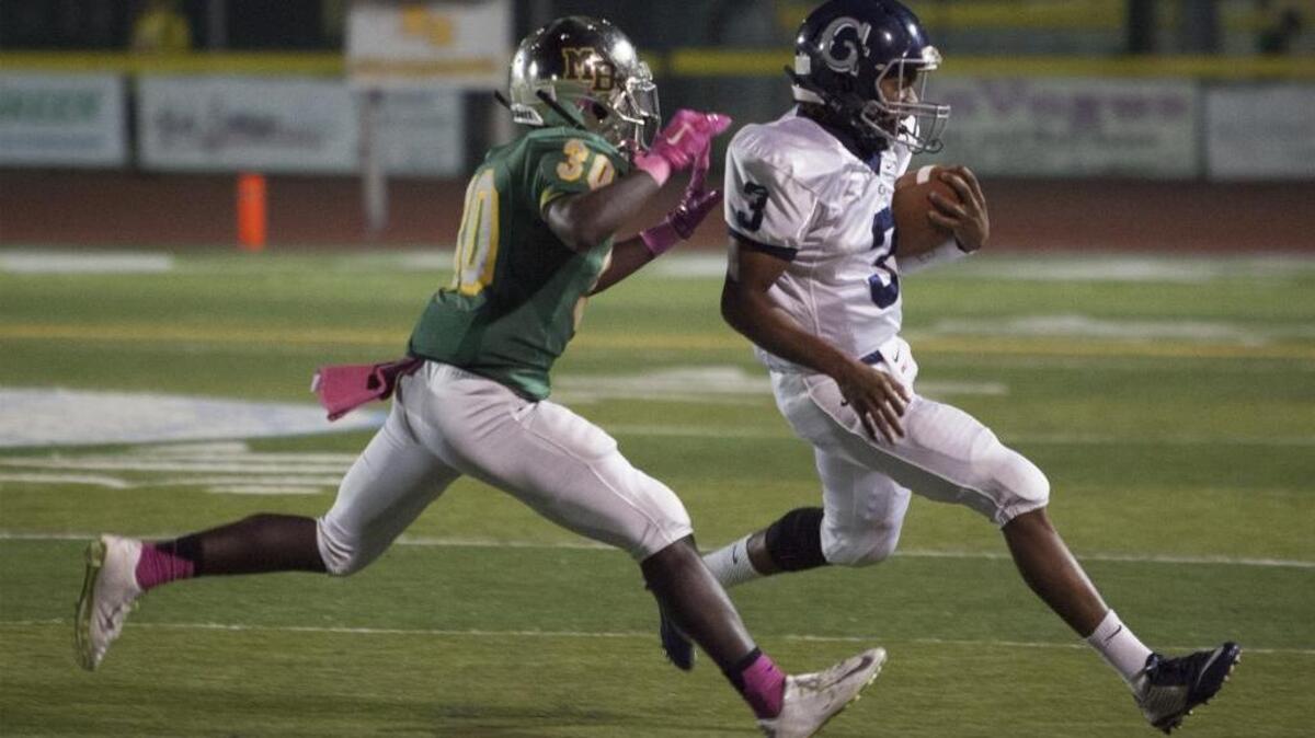 Georgetown’s Jarvis Brown (right) looks to elude Myrtle Beach linebacker Jermani Green during a game earlier this season.