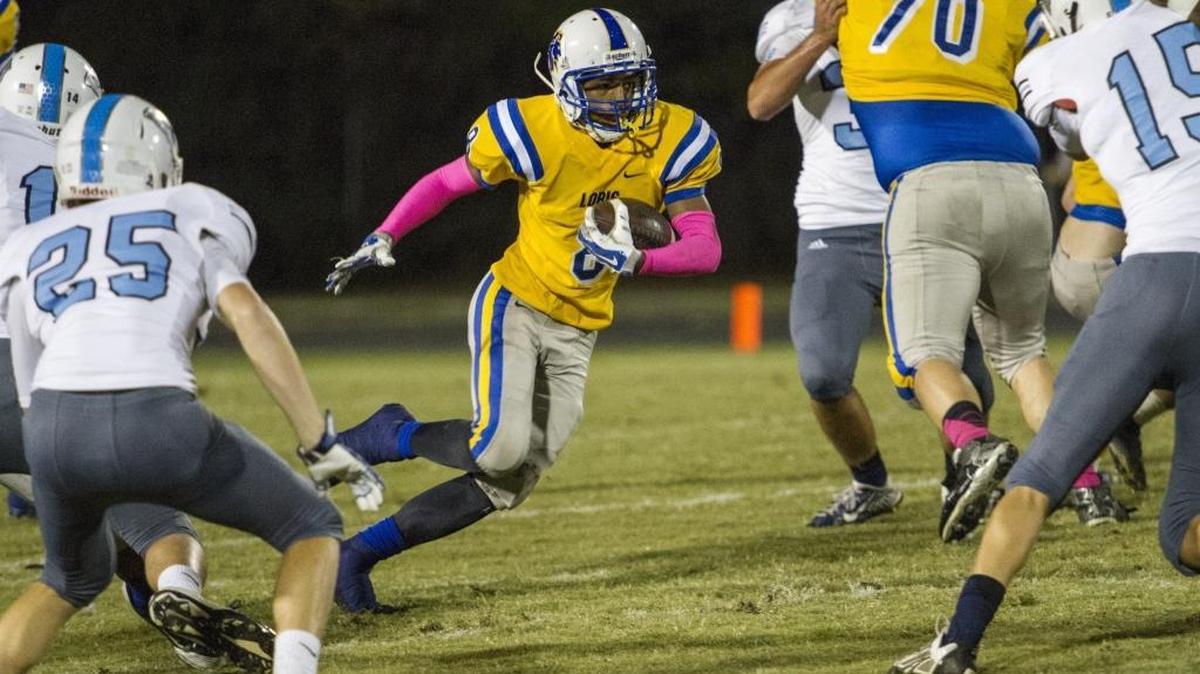 Loris’ Hakeem Jackson finds a hole in the Aynor defense during Friday’s game.