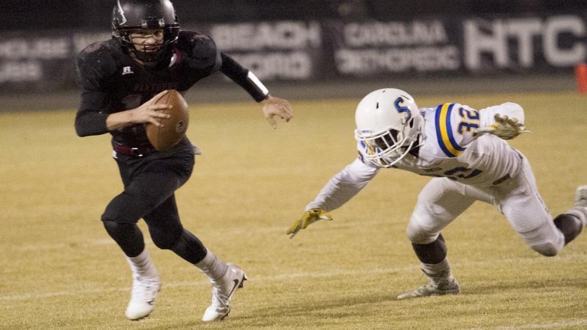 Carolina Forest quarterback Matt Beale scrambles under pressure from the Sumter defense during last Friday’s game.