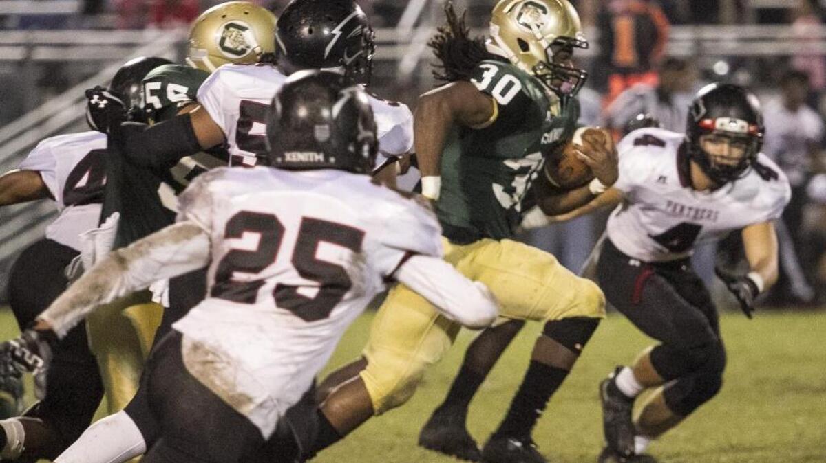 Conway’s Jah’Maine Martin breaks away from a pack of Carolina Forest defenders during Friday night’s game.