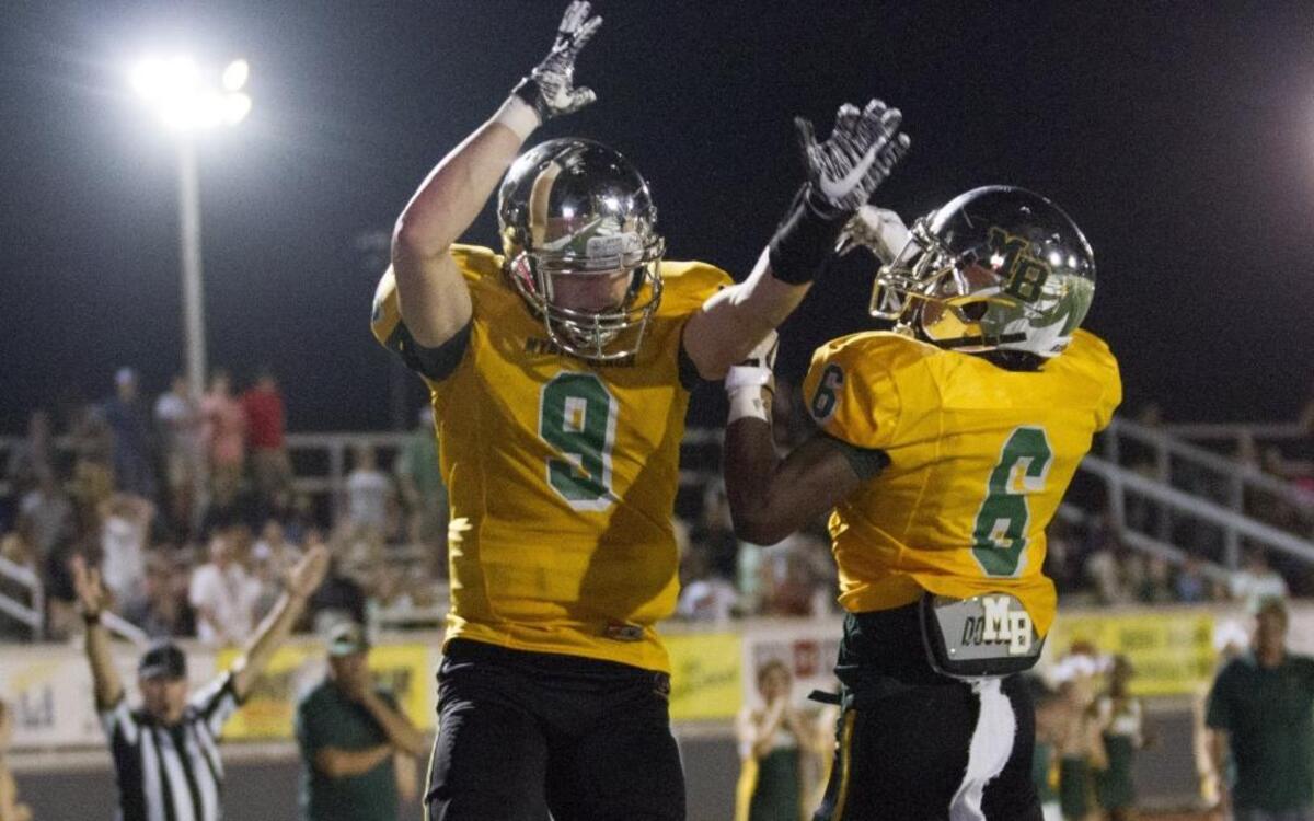 Myrtle Beach receiver Luke Doty celebrates with Chunk Grissett following a touchdown last week against Conway.