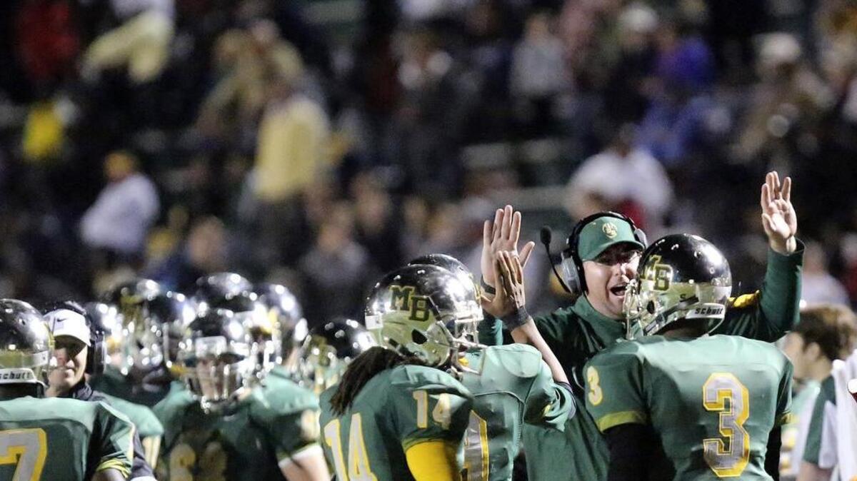 Myrtle Beach players and coaches celebrate during Friday’s win over Dreher.