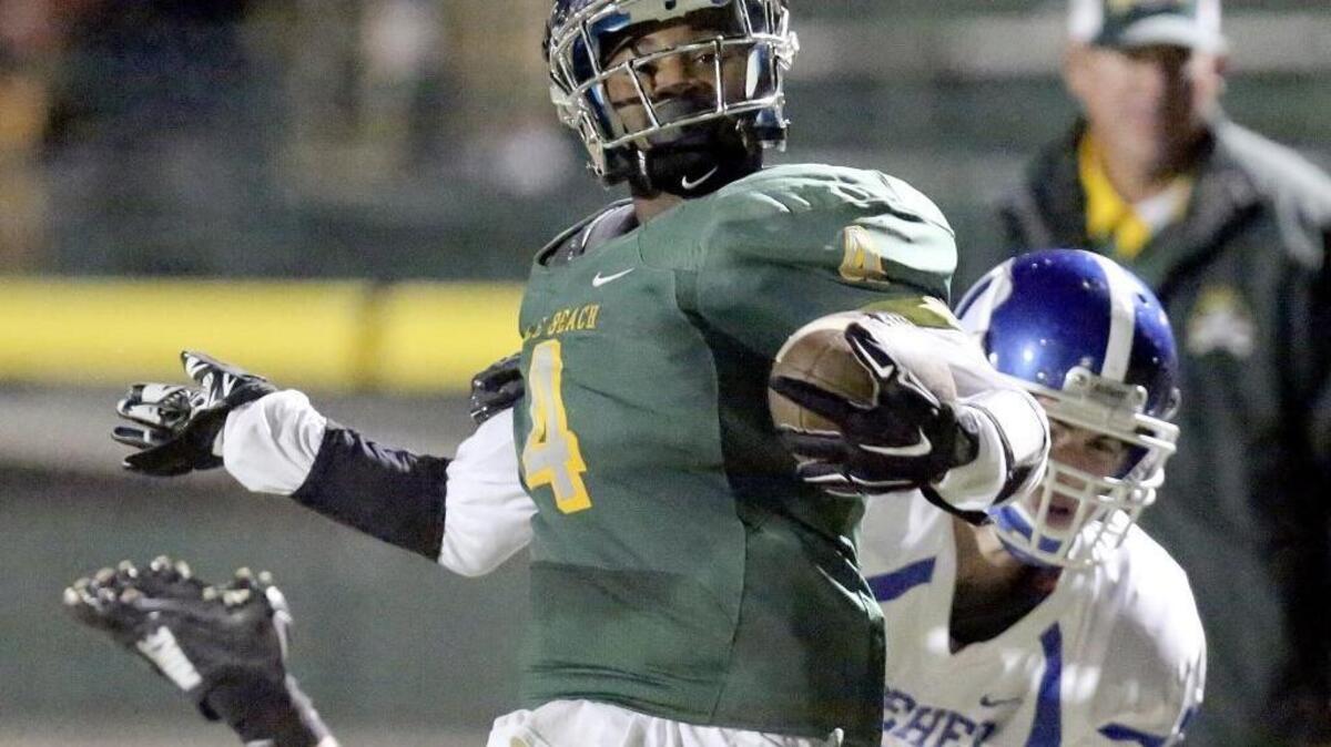 Myrtle Beach’s Elijah Rice scores on this run as Dreher’s Max Ward holds on during Friday’s first-round playoff game.