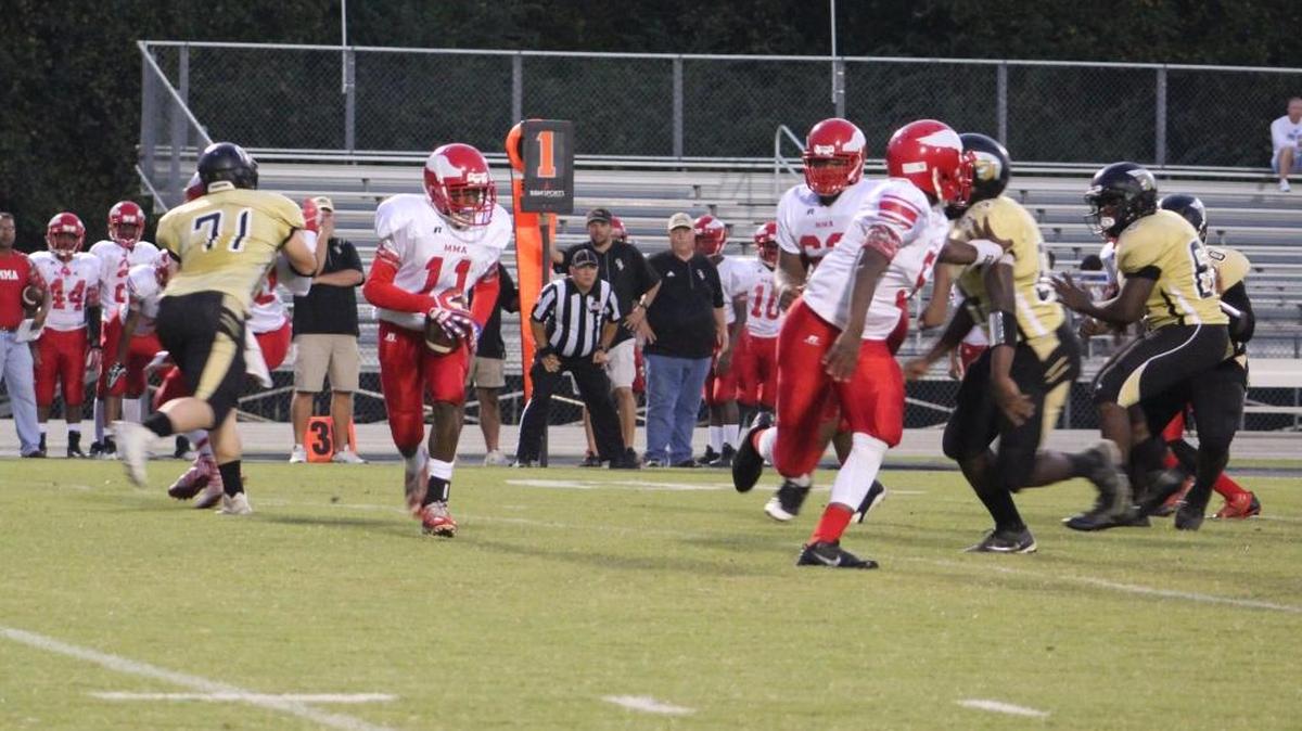 Military Magnet wideout Rashawn Smith (11) finds running room in the first quarter against Green Sea Floyds.