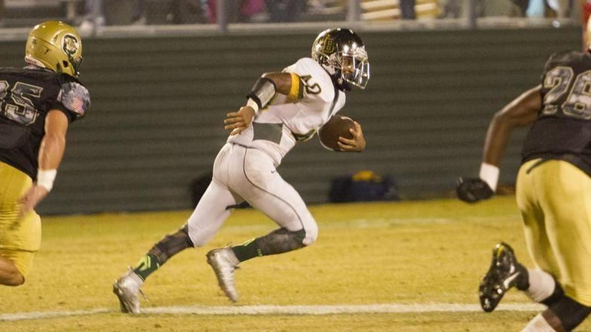 
Myrtle Beach's Jermani Green drives down field against the Conway Tigers. In a hard fought game between rivals Myrtle Beach and Conway, the Conway Tigers won back the Victory bell 25-22 Friday night.
