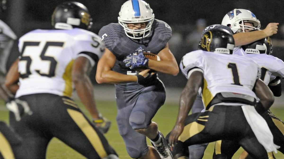 Aynor quarterback Caleb Jenerette (center) rushed for 481 yards and nine touchdowns a year ago.