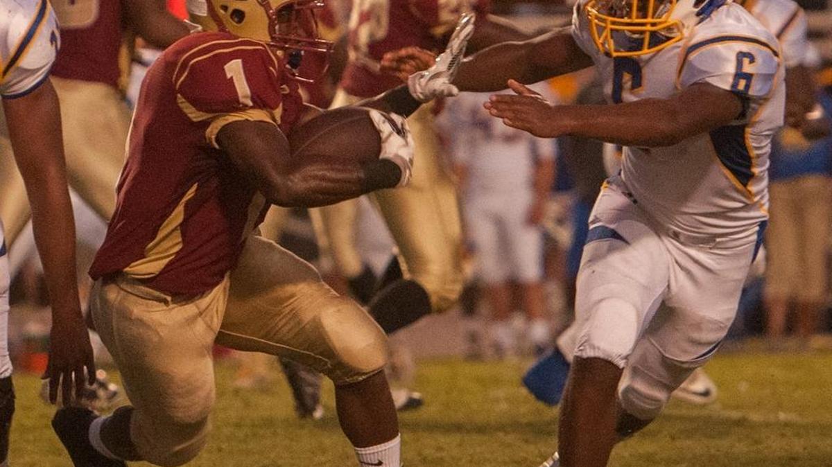 Running back Tyrek Reed (left) and his Carvers Bay teammates are set to clash with Stephon Wilson and North Myrtle Beach on Friday night.