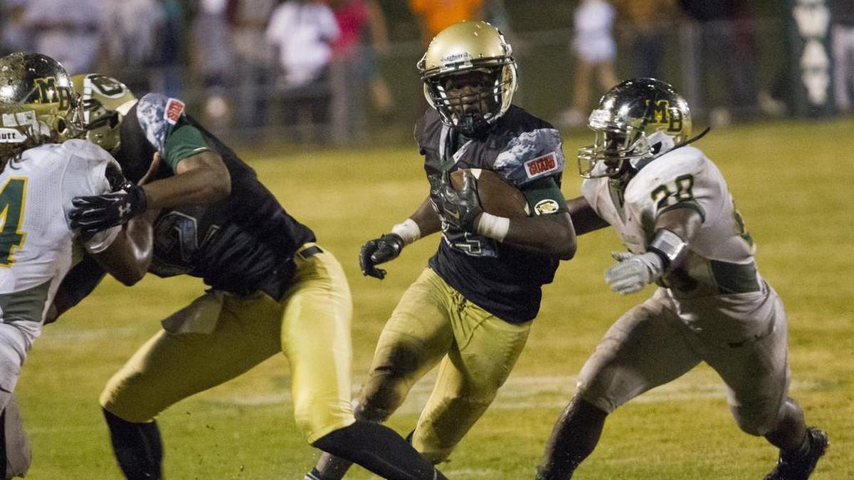 
Conway’s Tyrone Bennett shakes off a tackle by Myrtle Beach’s Anthoni Taylor earlier this season.
