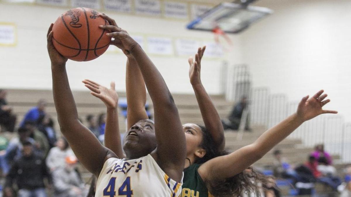 North Myrtle Beach’s Aquera Johnson gathers a rebound during a game earlier this month against Conway.