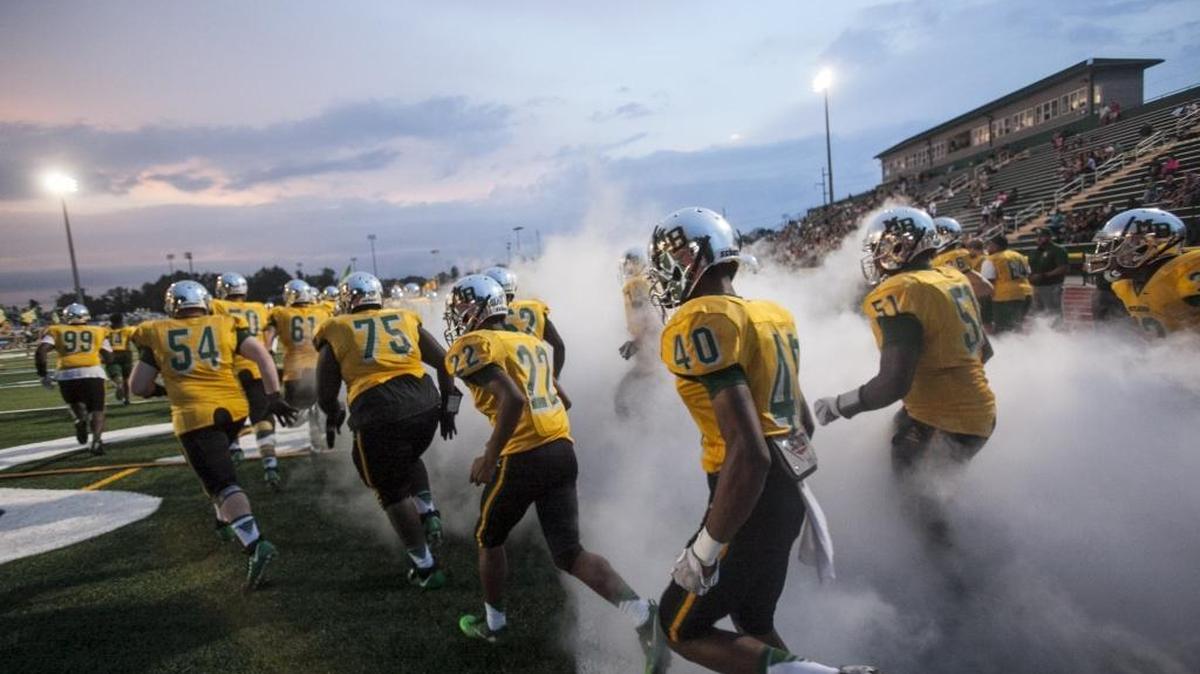 The Myrtle Beach High football team hits the field ahead of its matchup with rival Conway this past September. Student-athletes are among those who Horry County Schools has discussed randomly drug-testing.