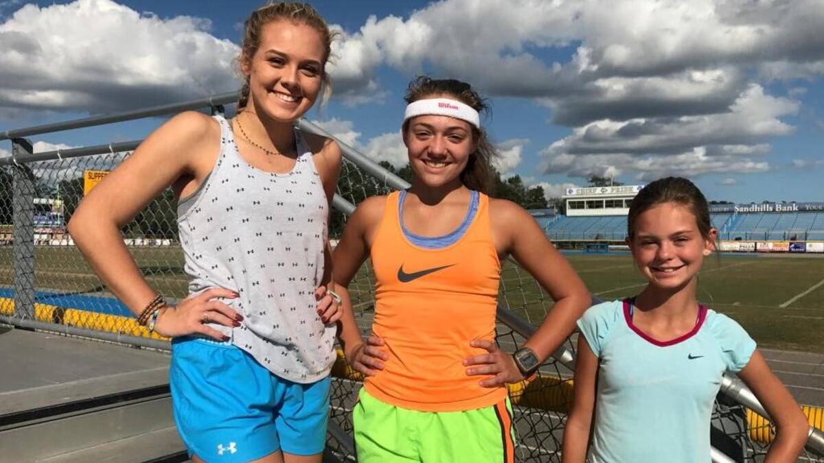 North Myrtle Beach cross country standouts Wilson Jenerette (center) along with Breeauna (left) and Isabella Spickler hopes their performance Saturday allows the Chiefs to bring home a state title.