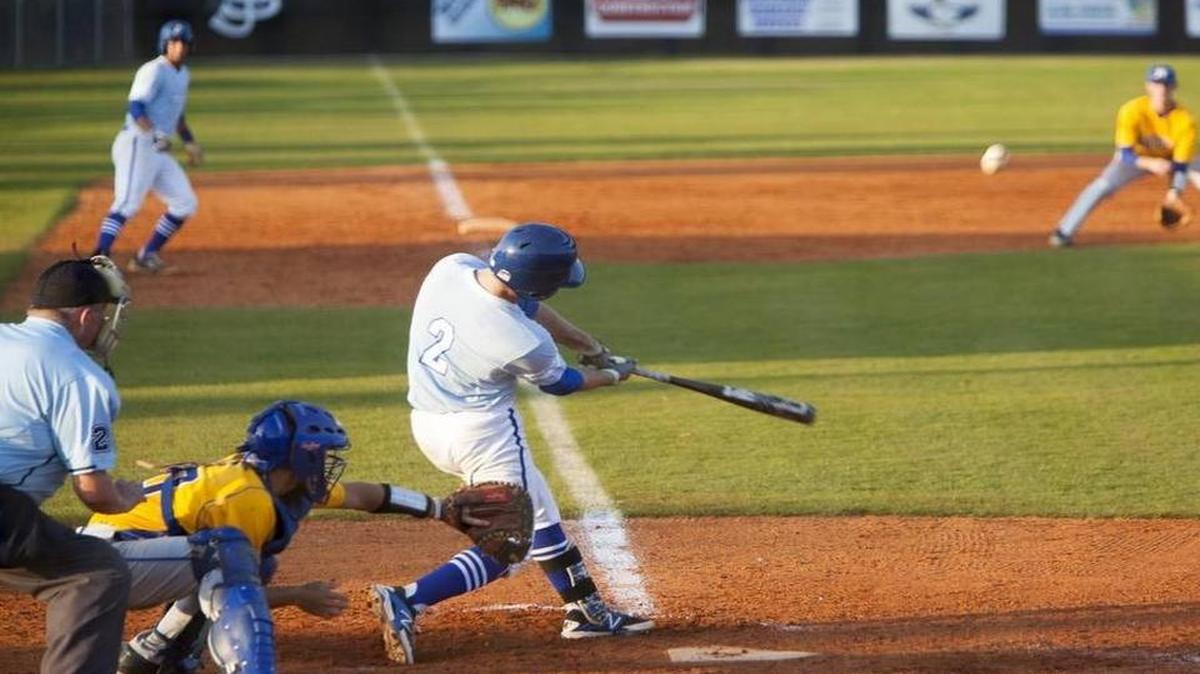 
St. James' Martin Drake with a sacrifice fly ball against North Myrtle Beach.
