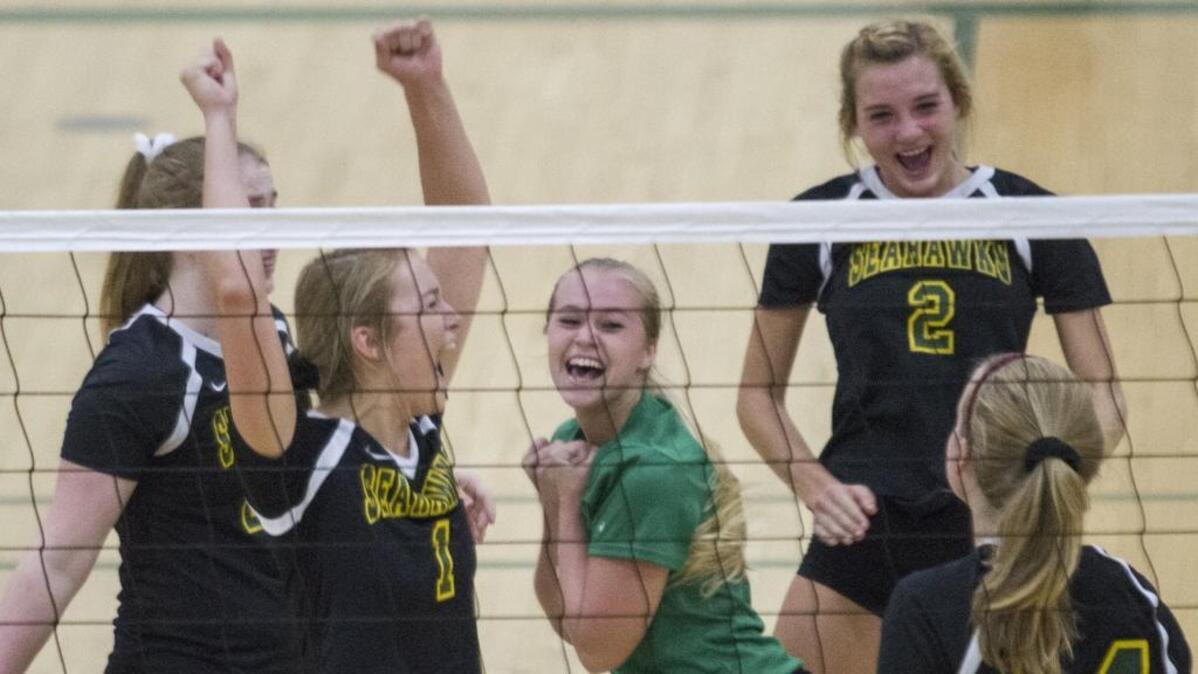 Myrtle Beach volleyball players celebrate after winning a point against North Myrtle Beach on Tuesday in the Lower State 4A final.