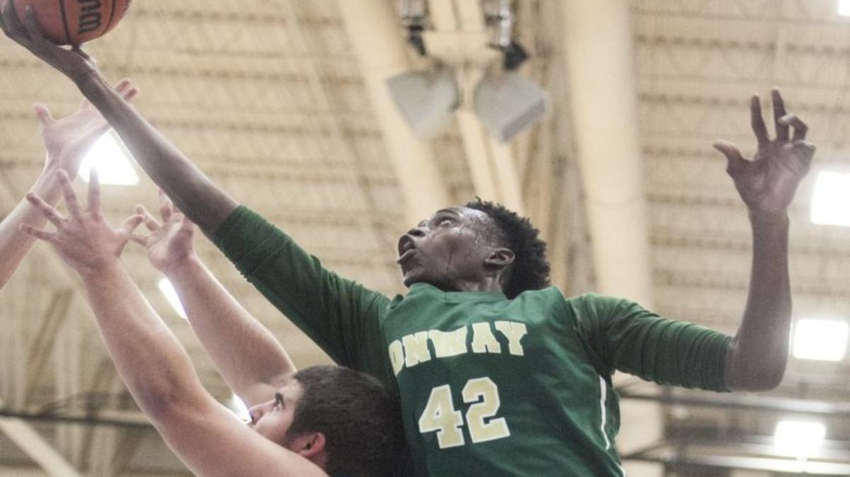 Conway power forward Jimmy Nichols gets a shot off during a game against St. James last year.