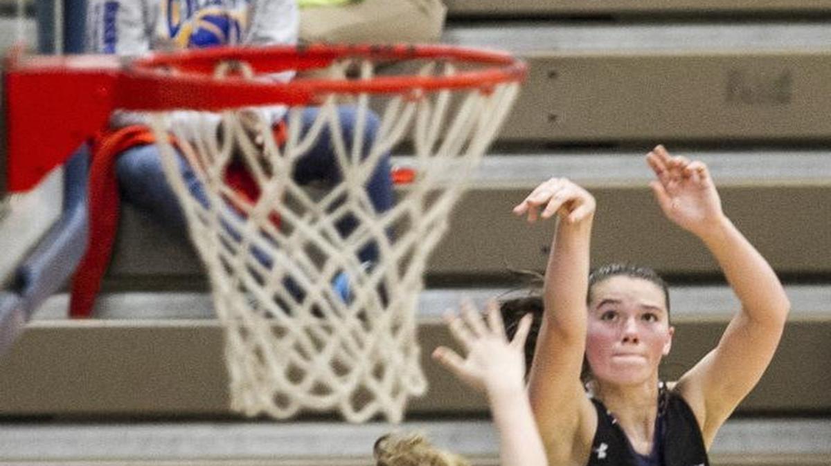 Chantilly’s Mary Clougherty shoots from the sideline over Orange’s Caleigh Orlando during Wednesday’s Shootout by the Sea championship game.